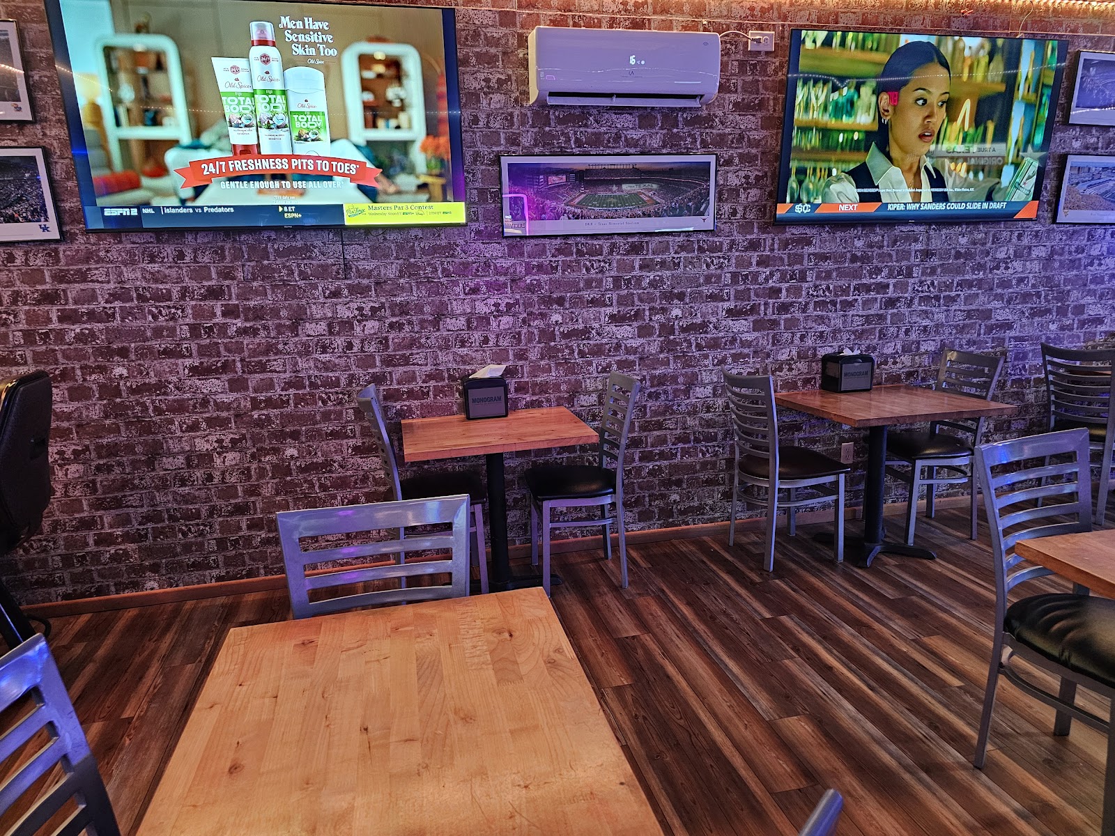Old 181 Bar and Grill dining area with TVs on brick wall